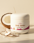 Coconut Cloud Whipped Body Butter jar with a halved coconut and fresh coconut chips on cream marble