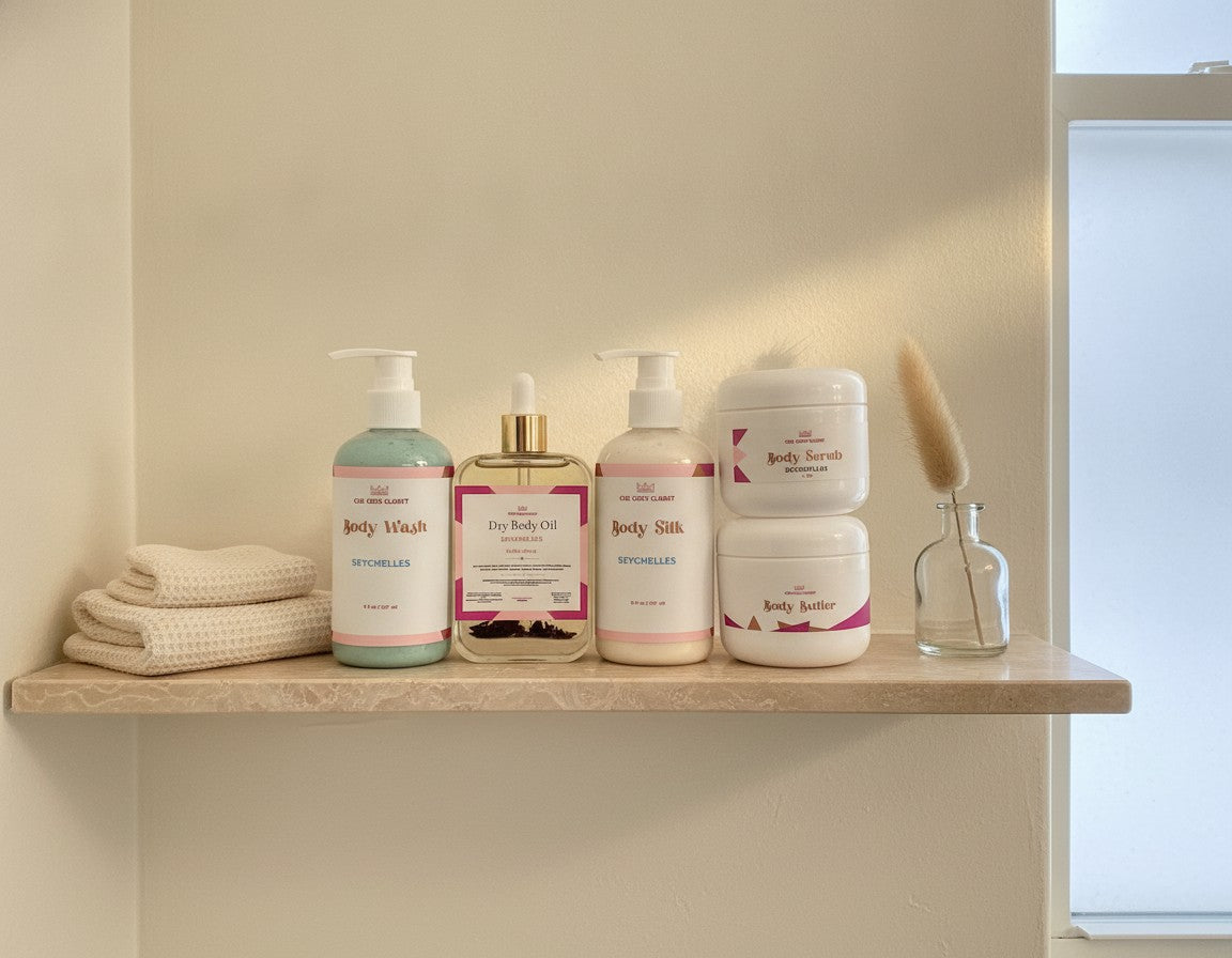 Seychelles Body Wash, Dry Body Oil, Body Silk, Body Scrub and Body Butter on a travertine bathroom shelf