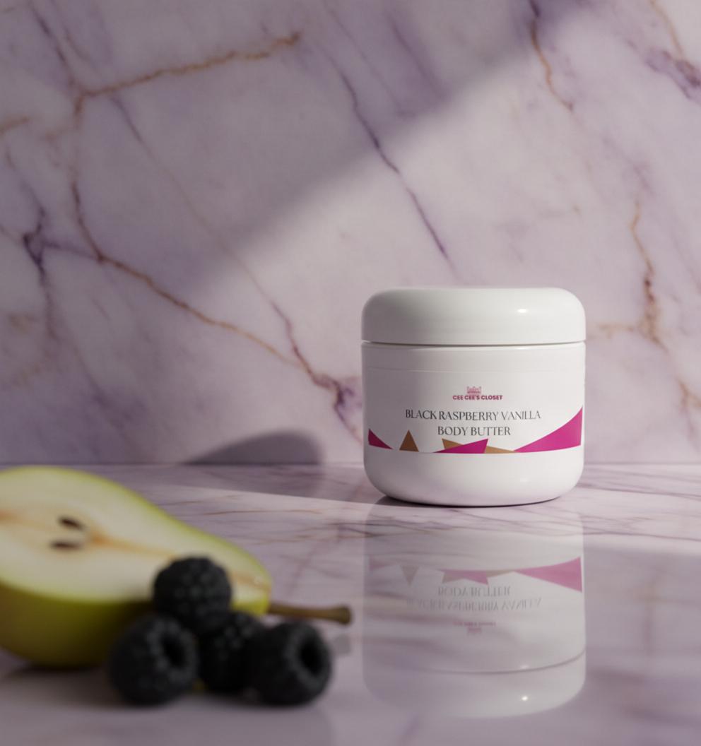 Black Raspberry Vanilla Body Butter on marble with pear and blackberries in the foreground