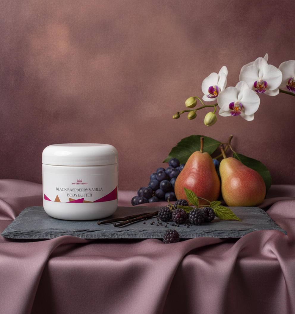 Black Raspberry Vanilla Body Butter on slate with pears, grapes, blackberries, vanilla beans and orchids