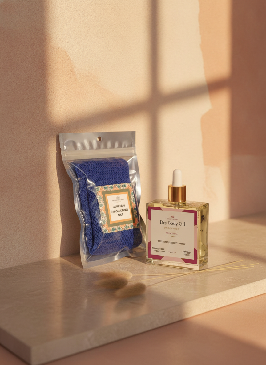Royal African Exfoliating Net and Unscented Dry Body Oil on a marble slab in soft window shadow