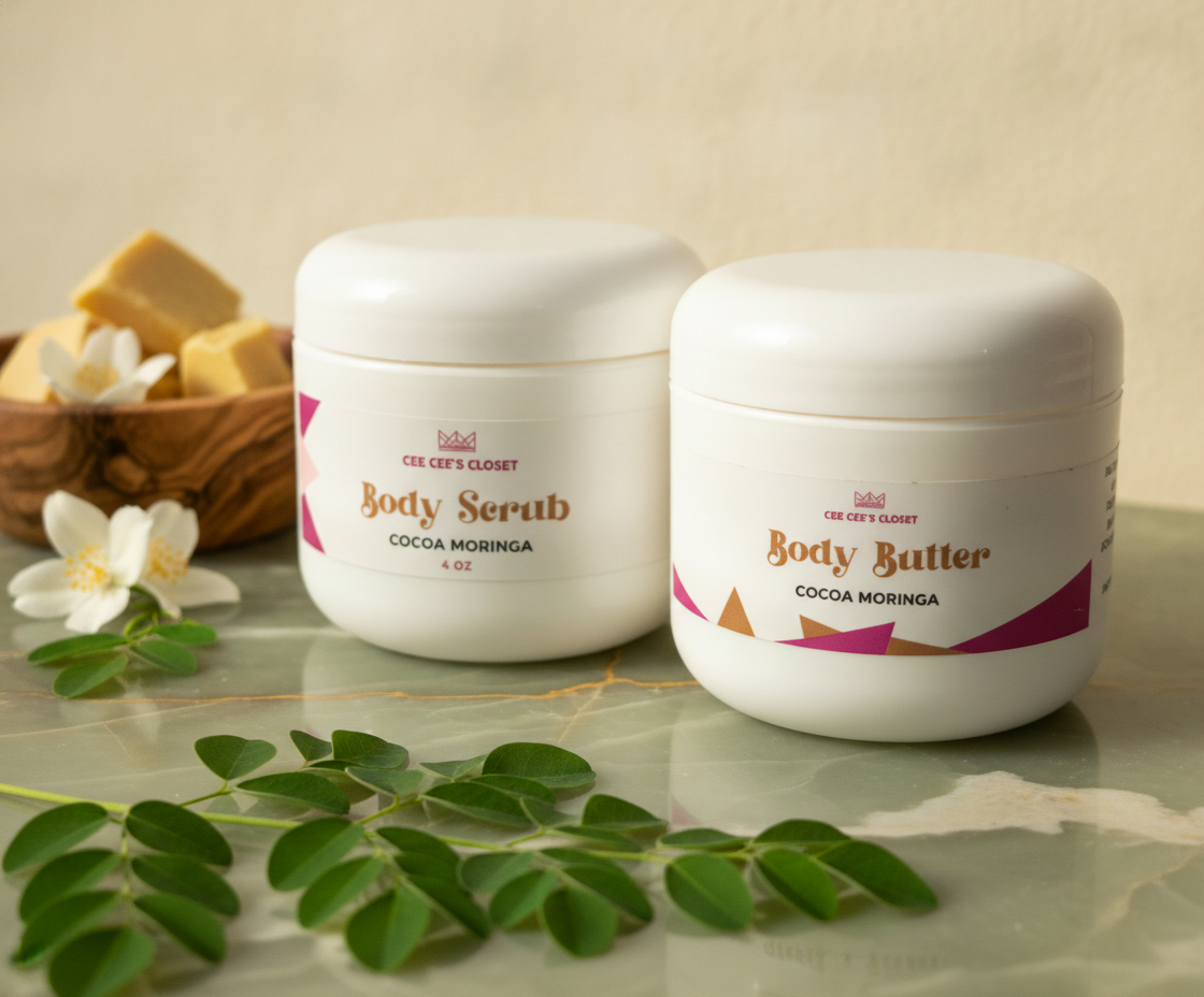 Soft Skin Set in Cocoa Moringa – Body Scrub and Body Butter on green marble with moringa leaves and jasmine