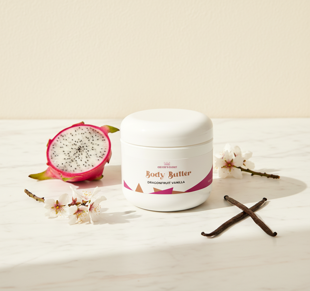 Dragonfruit Vanilla Whipped Body Butter on marble with dragonfruit, blossoms and crossed vanilla pods