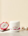 Dragonfruit Vanilla Whipped Body Butter with halved dragonfruit, vanilla pods and almond blossoms