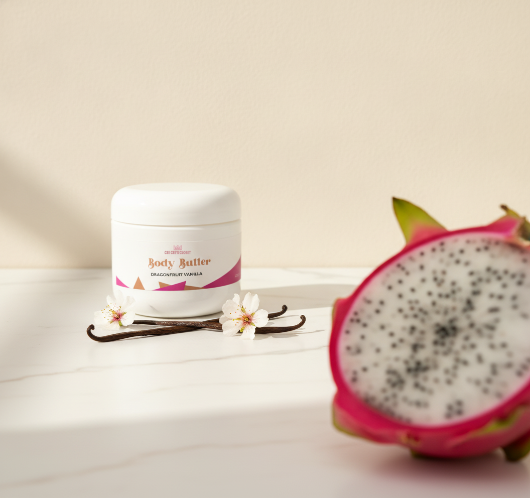Dragonfruit Vanilla Whipped Body Butter on marble with vanilla pods and blossoms, dragonfruit in the foreground