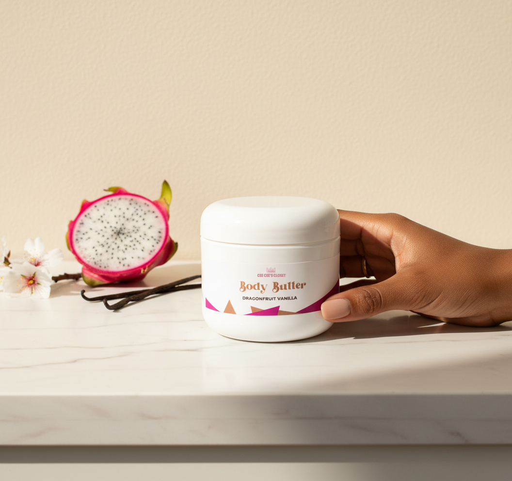 Hand holding a Dragonfruit Vanilla Whipped Body Butter jar with dragonfruit and vanilla