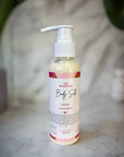 Body Silk Lotion bottle with label on a pink surface