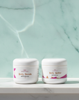 Soft Skin Set in Seychelles – Body Scrub and Body Butter on white marble with seafoam backdrop